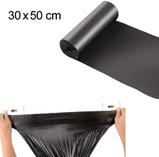 Large black garbage bags, environmentally friendly and durable.