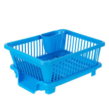 Plastic dish drainer rack with a brown box for drying dishes and utensils